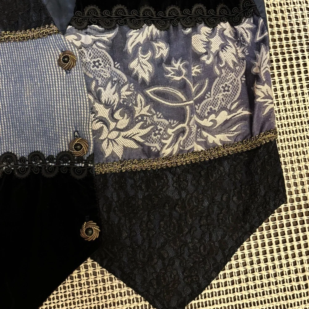 Judy Knapp Vintage vest in various shades of blue by with a printed design SizeS